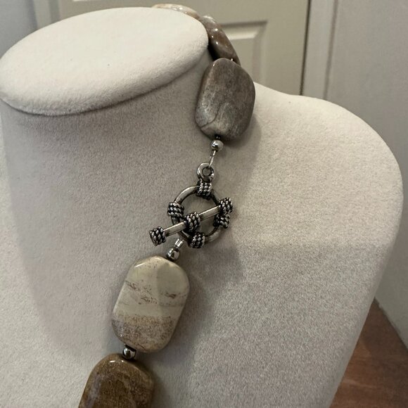 This necklace is a chunky, natural stone necklace with a carved flower pendant - Picture 3 of 10